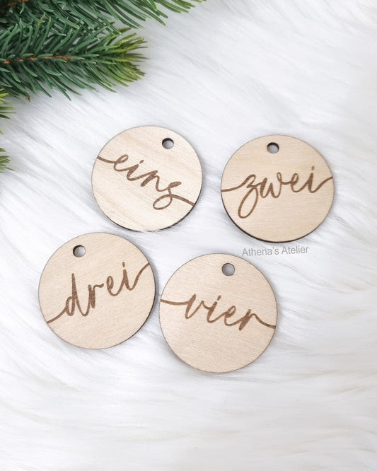 Runde Adventszahlen 1-4 aus Birkenholz gelasert